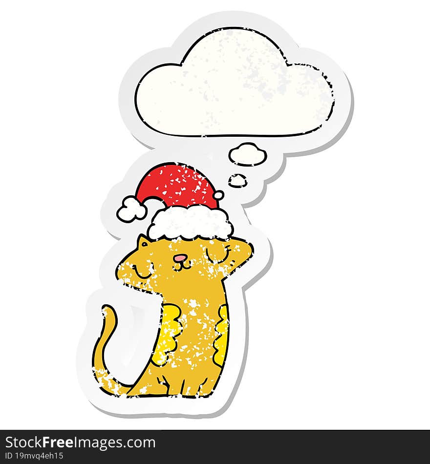 cute cartoon cat wearing christmas hat and thought bubble as a distressed worn sticker