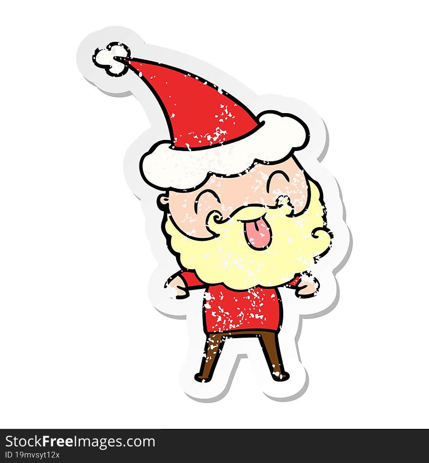 man with beard sticking out tongue wearing santa hat