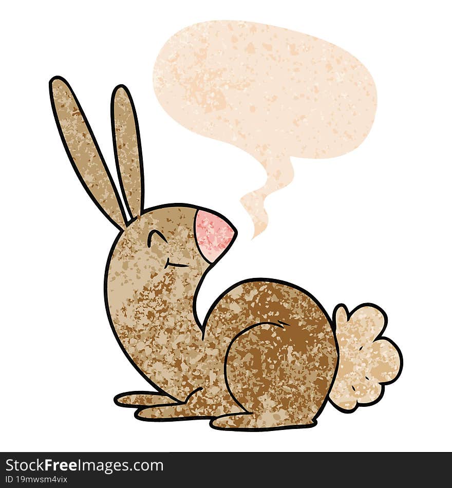 cute cartoon rabbit and speech bubble in retro textured style