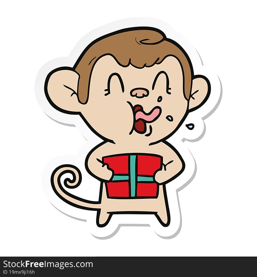 sticker of a crazy cartoon monkey with christmas present