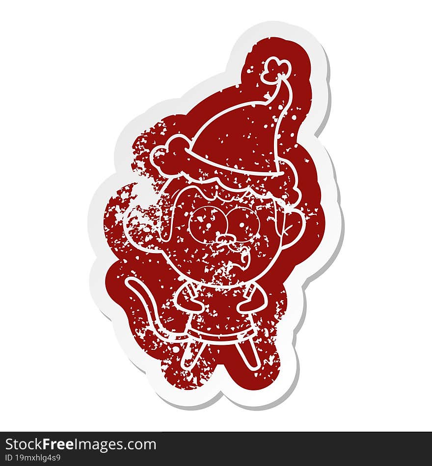 Cartoon Distressed Sticker Of A Surprised Monkey Wearing Santa Hat