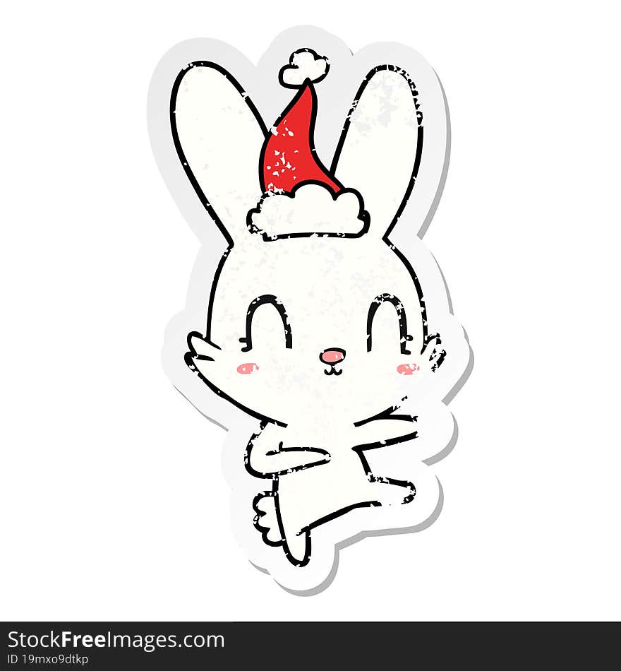 Cute Distressed Sticker Cartoon Of A Rabbit Dancing Wearing Santa Hat