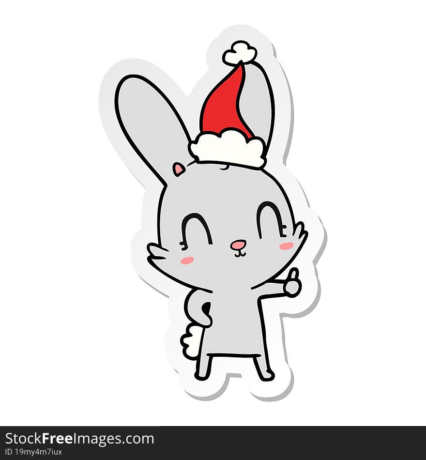 cute sticker cartoon of a rabbit wearing santa hat