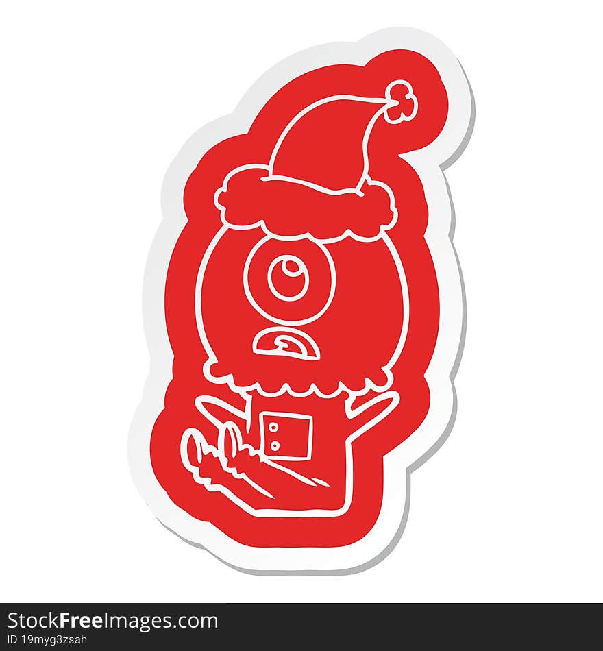 Cartoon  Sticker Of A Cyclops Alien Spaceman Wearing Santa Hat