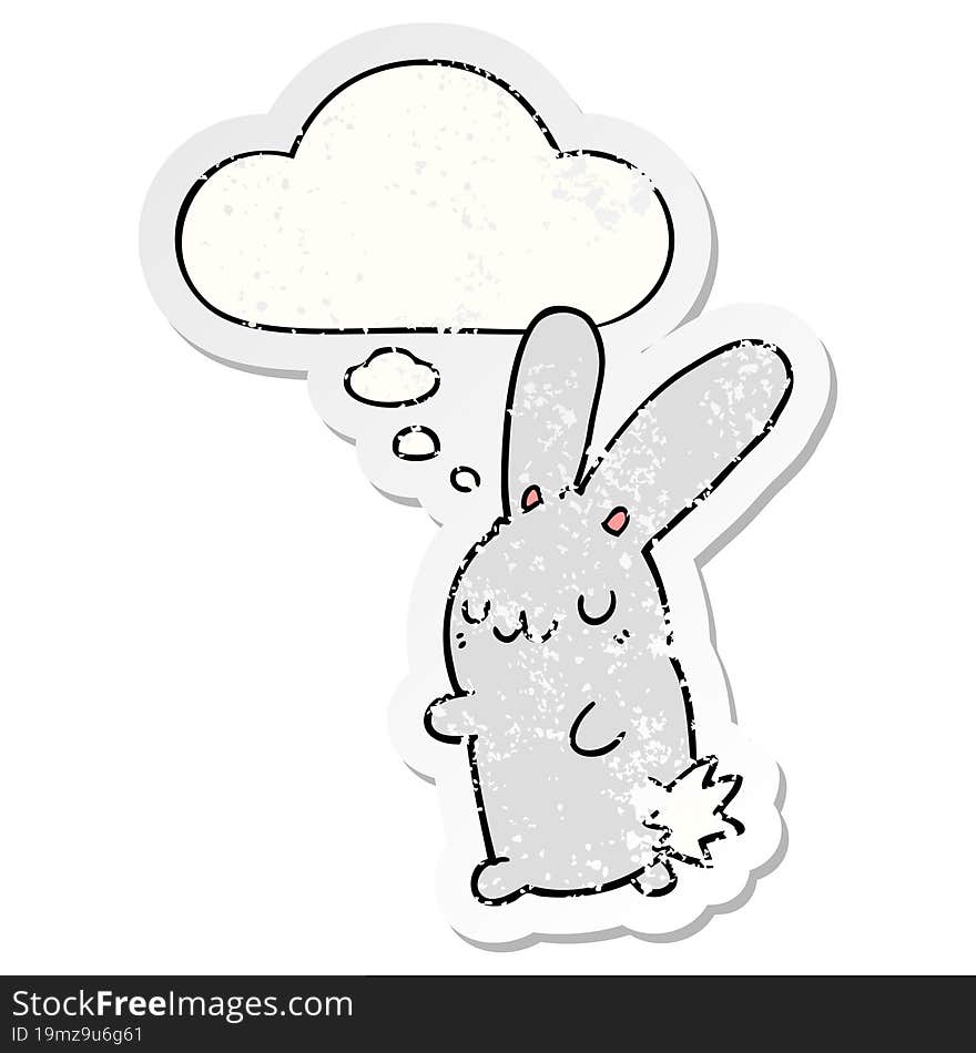 cute cartoon rabbit and thought bubble as a distressed worn sticker