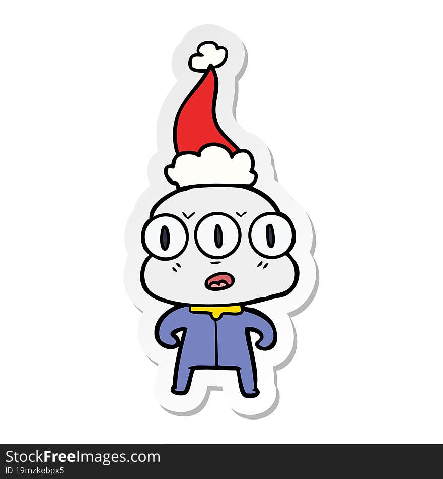 sticker cartoon of a three eyed alien wearing santa hat