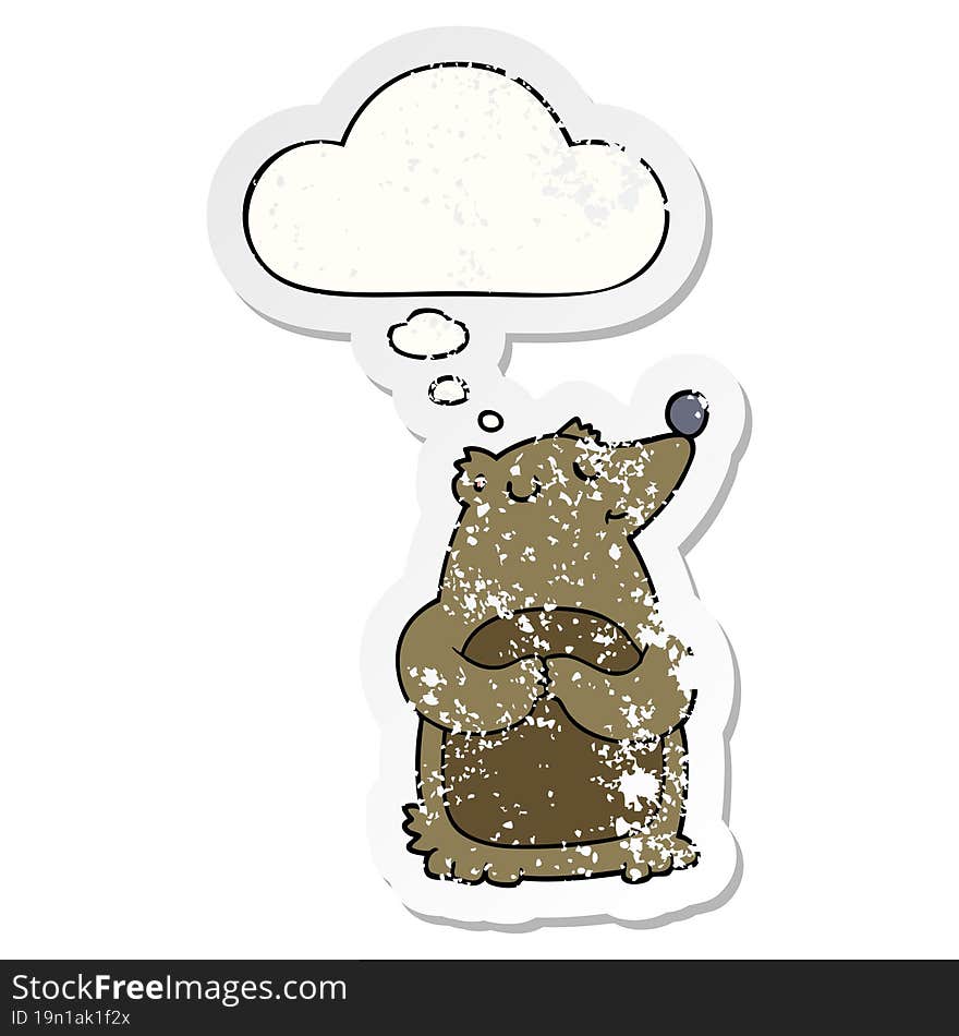 cartoon bear and thought bubble as a distressed worn sticker