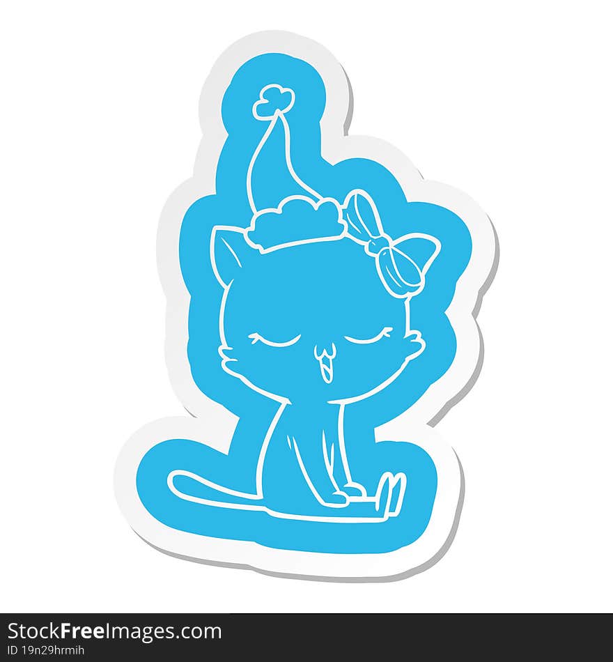 quirky cartoon  sticker of a cat with bow on head wearing santa hat