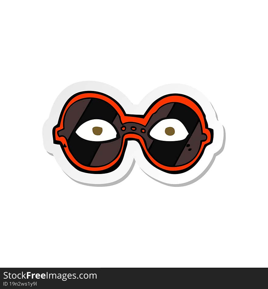 sticker of a cartoon eyes in dark glasses