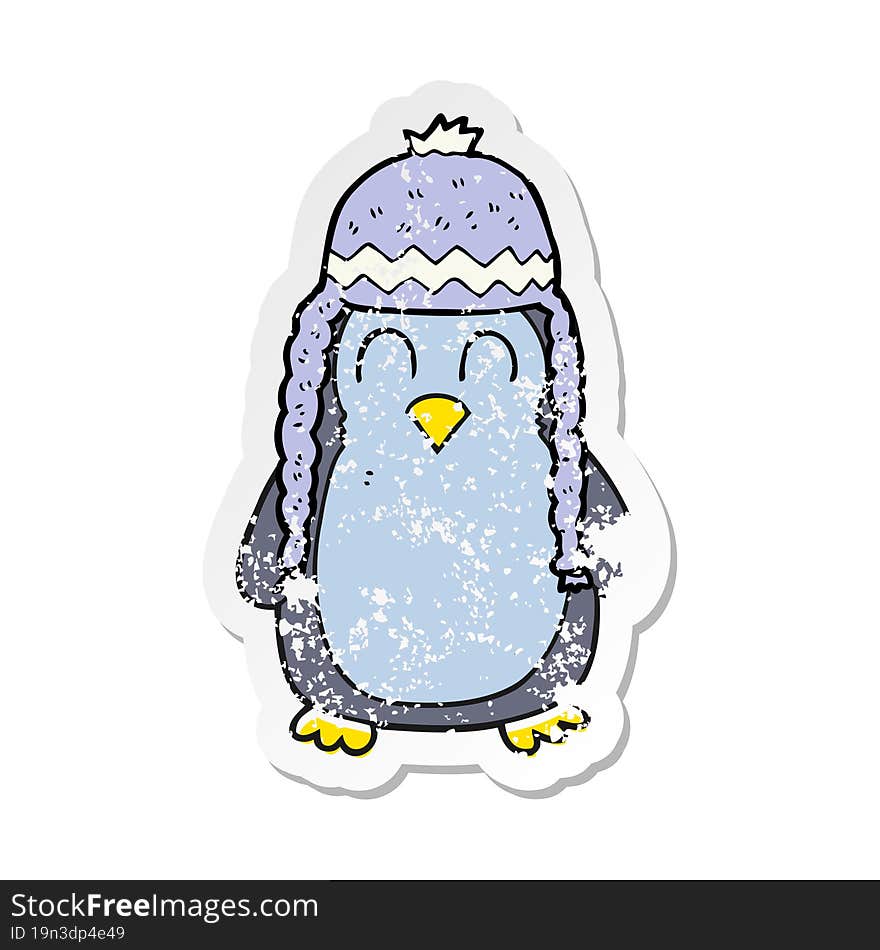 retro distressed sticker of a cartoon penguin wearing hat