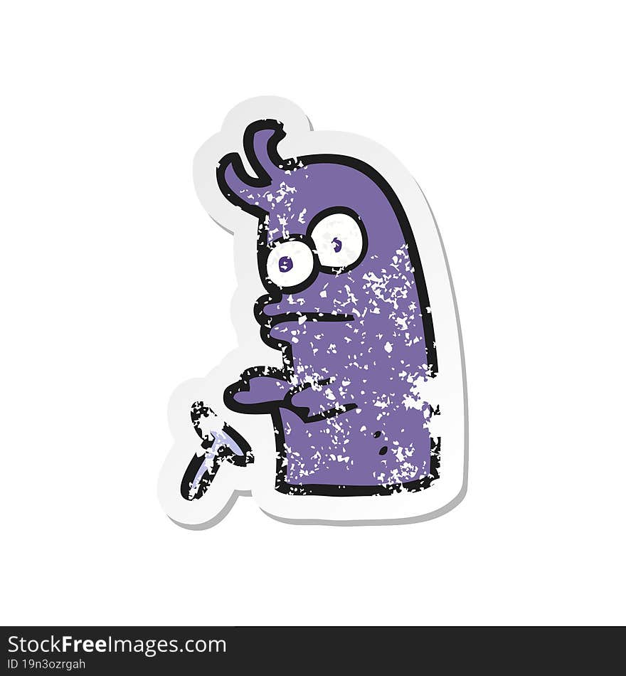 Retro Distressed Sticker Of A Cartoon Little Alien