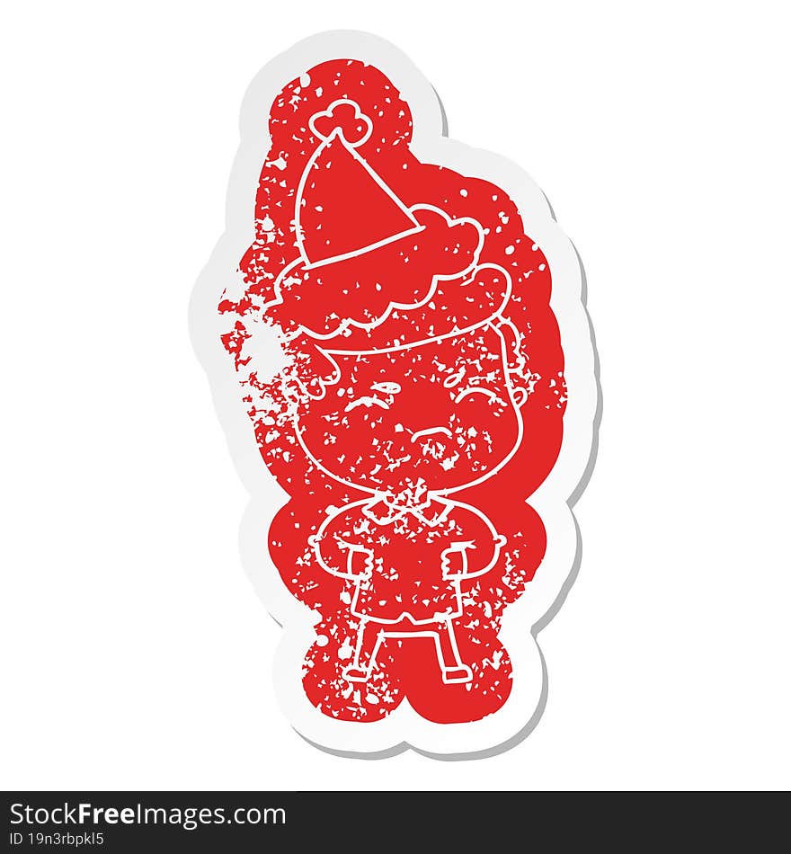 quirky cartoon distressed sticker of a annoyed man wearing santa hat