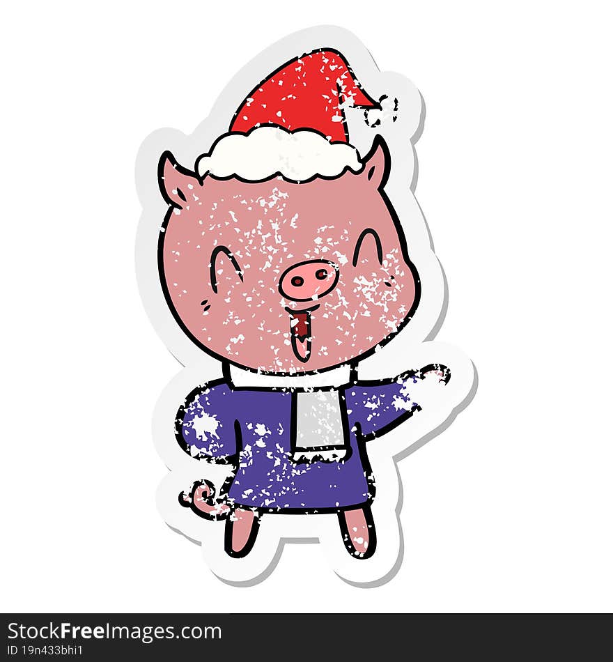 happy distressed sticker cartoon of a pig in winter clothes wearing santa hat