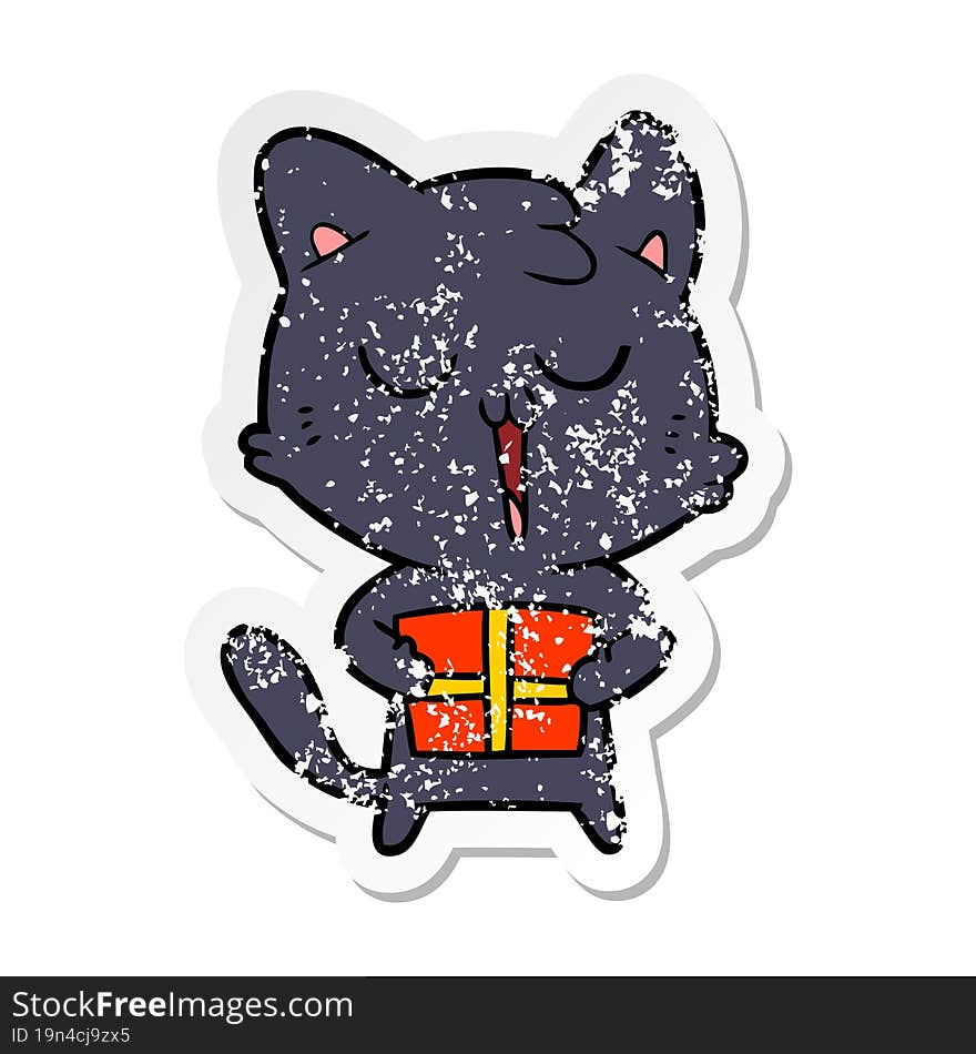 Distressed Sticker Of A Cartoon Cat With Present