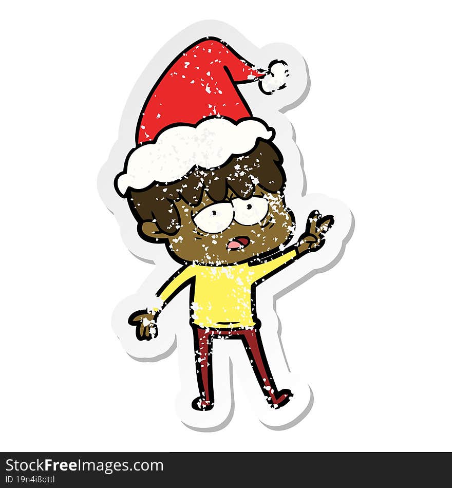 distressed sticker cartoon of a exhausted boy wearing santa hat