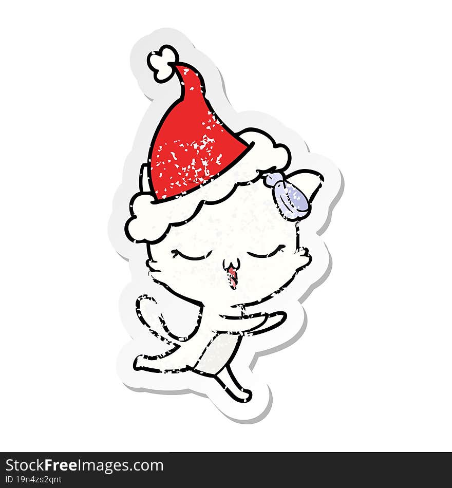 Distressed Sticker Cartoon Of A Cat With Bow On Head Wearing Santa Hat