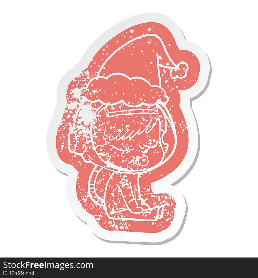 quirky cartoon distressed sticker of a pretty astronaut girl sitting waiting wearing santa hat