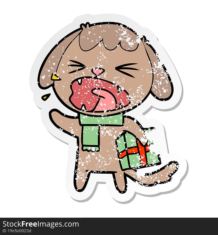 distressed sticker of a cute cartoon dog with christmas present