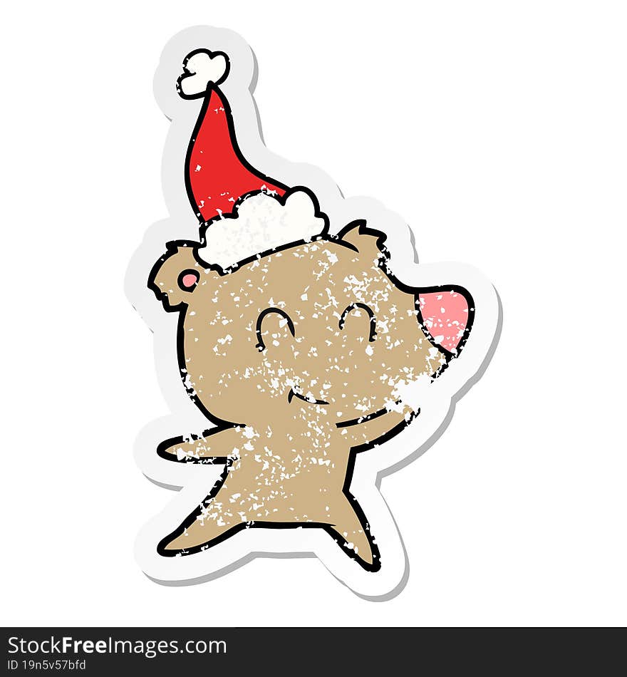 female bear distressed sticker cartoon of a wearing santa hat