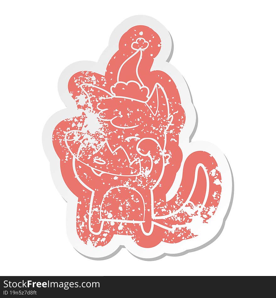 cartoon distressed sticker of a fox wearing santa hat