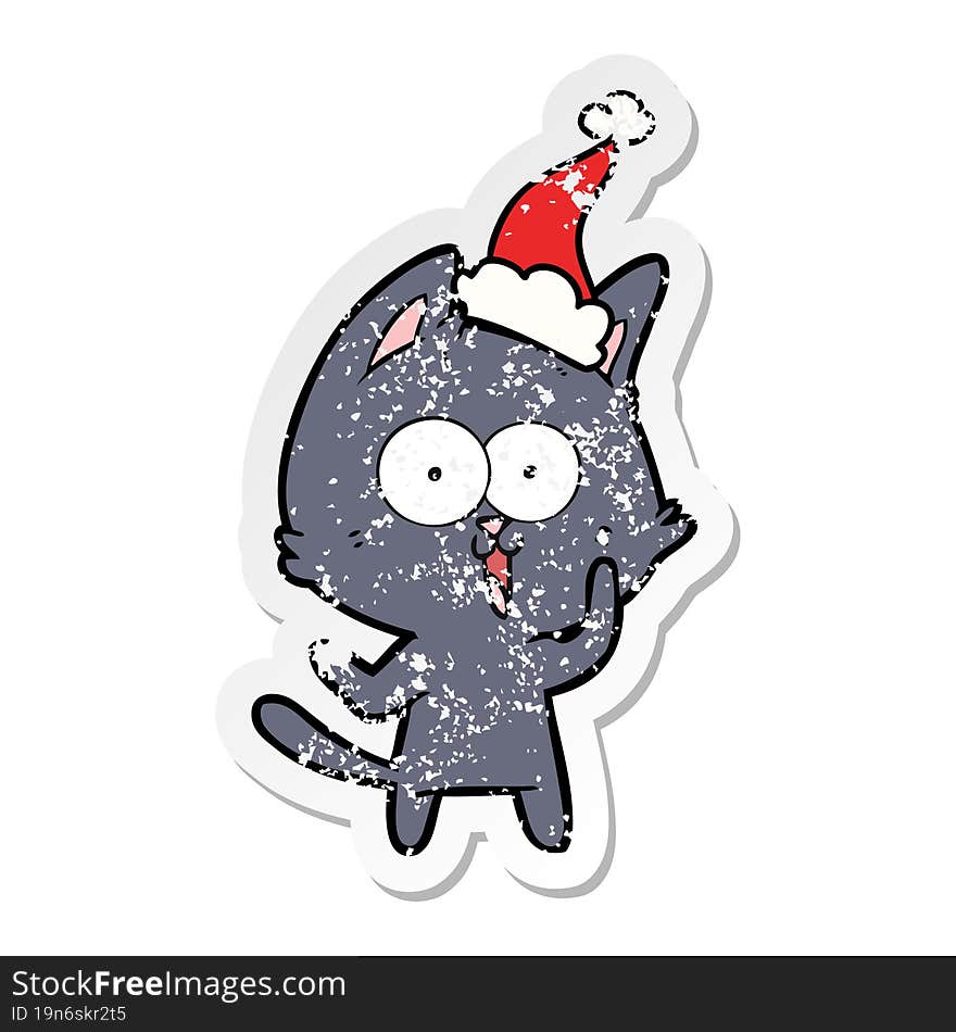 funny distressed sticker cartoon of a cat wearing santa hat