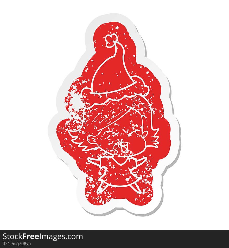 happy cartoon distressed sticker of a girl wearing santa hat