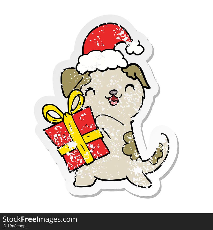 distressed sticker of a cute cartoon puppy with christmas present and hat