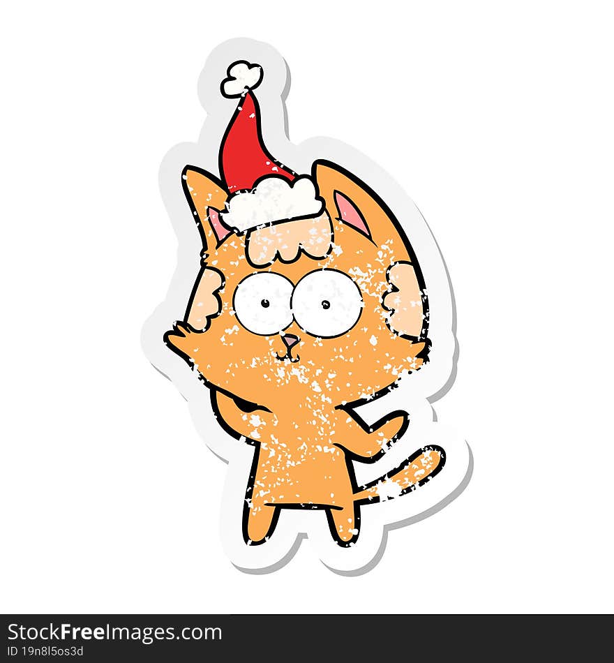 happy distressed sticker cartoon of a cat wearing santa hat