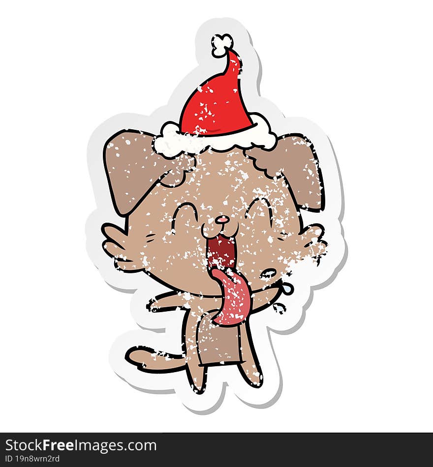 distressed sticker cartoon of a panting dog wearing santa hat