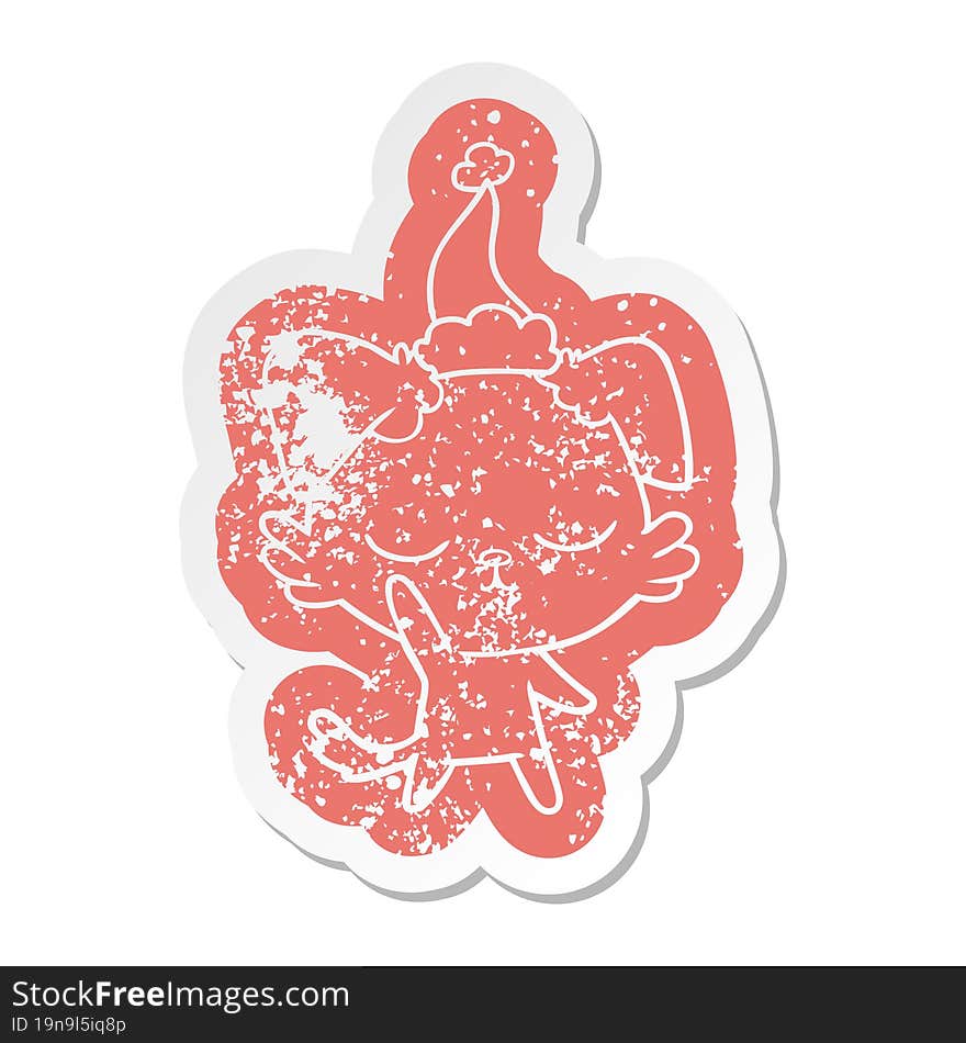 cute cartoon distressed sticker of a dog wearing santa hat