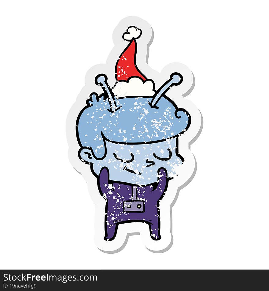 shy distressed sticker cartoon of a spaceman wearing santa hat