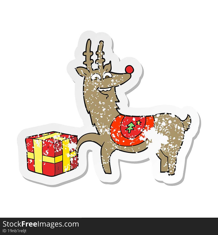 retro distressed sticker of a cartoon christmas reindeer with present