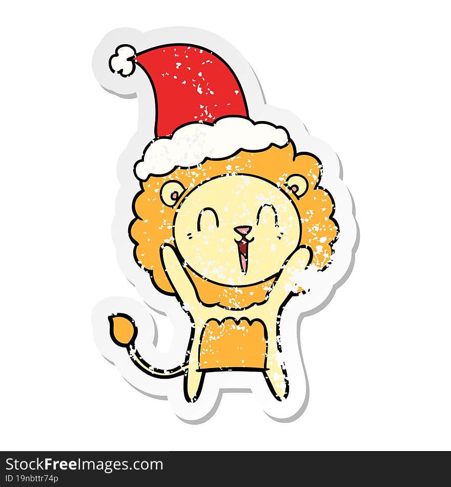 laughing lion distressed sticker cartoon of a wearing santa hat