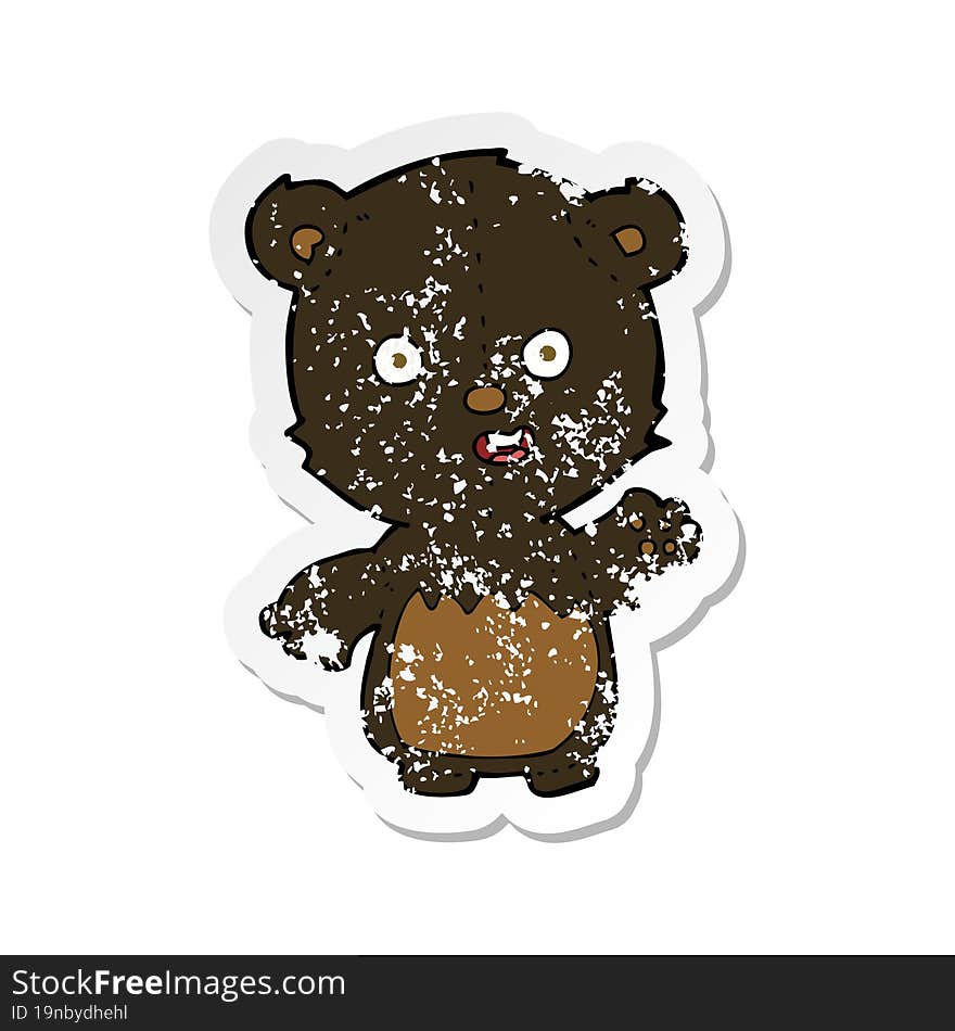 retro distressed sticker of a cartoon waving black bear cub