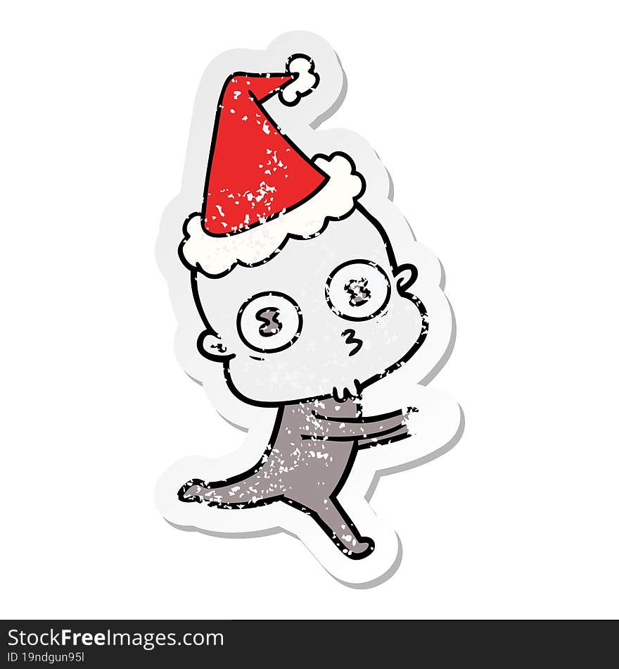 hand drawn distressed sticker cartoon of a weird bald spaceman running wearing santa hat