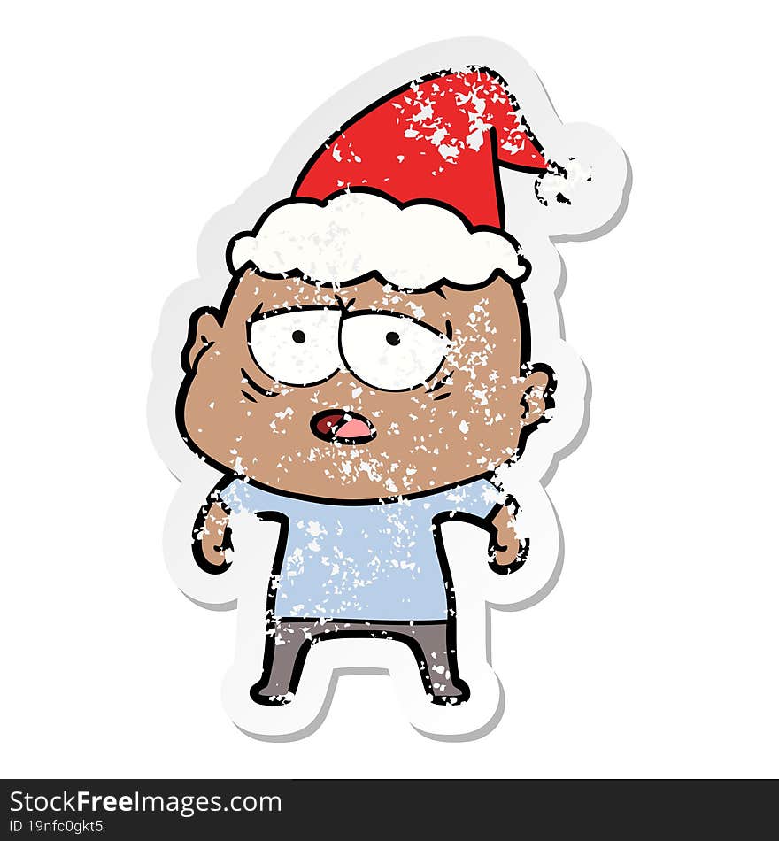 distressed sticker cartoon of a tired bald man wearing santa hat