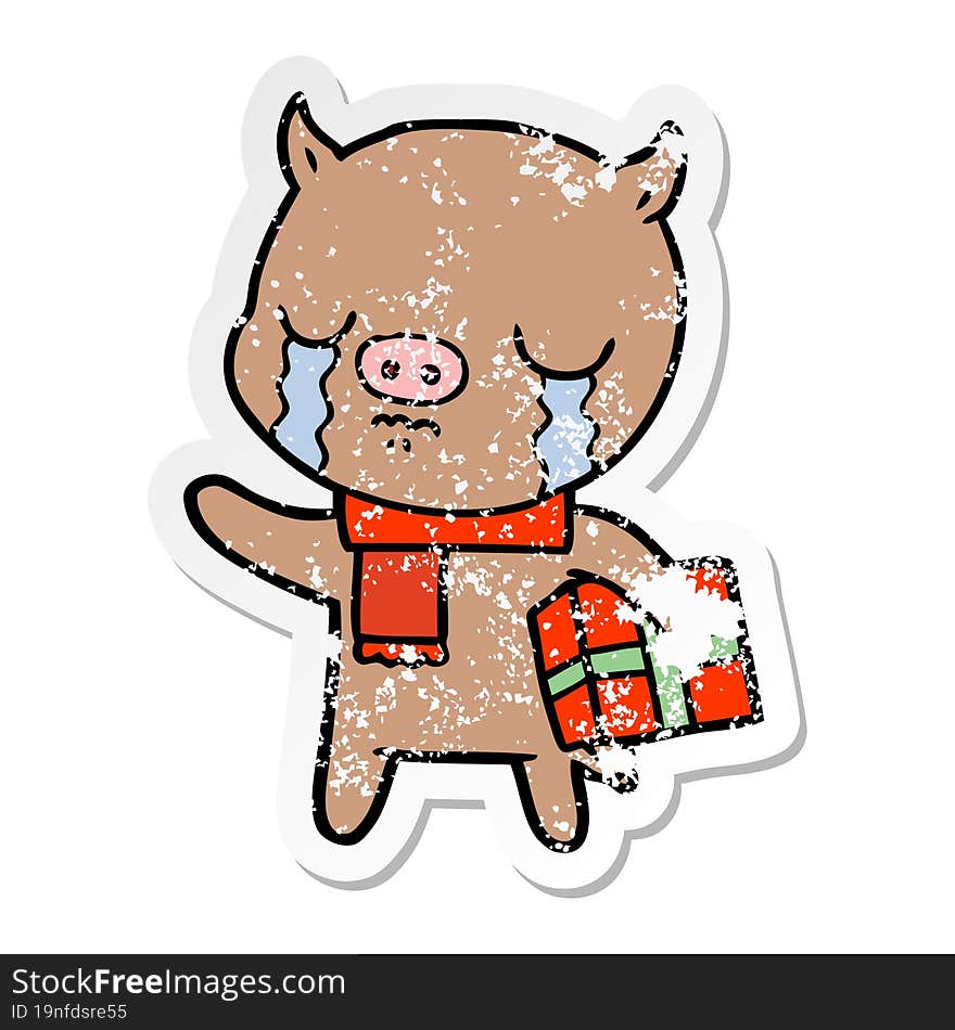 distressed sticker of a cartoon pig crying over christmas present