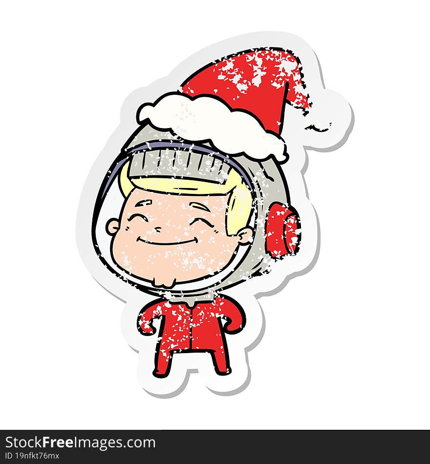 happy distressed sticker cartoon of a astronaut wearing santa hat