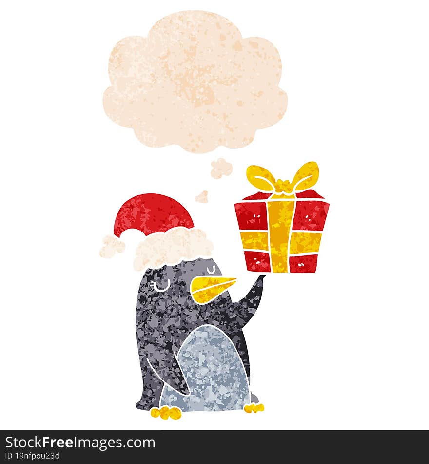 cartoon penguin with christmas present with thought bubble in grunge distressed retro textured style. cartoon penguin with christmas present with thought bubble in grunge distressed retro textured style