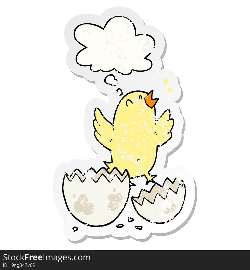 cartoon bird hatching from egg with thought bubble as a distressed worn sticker