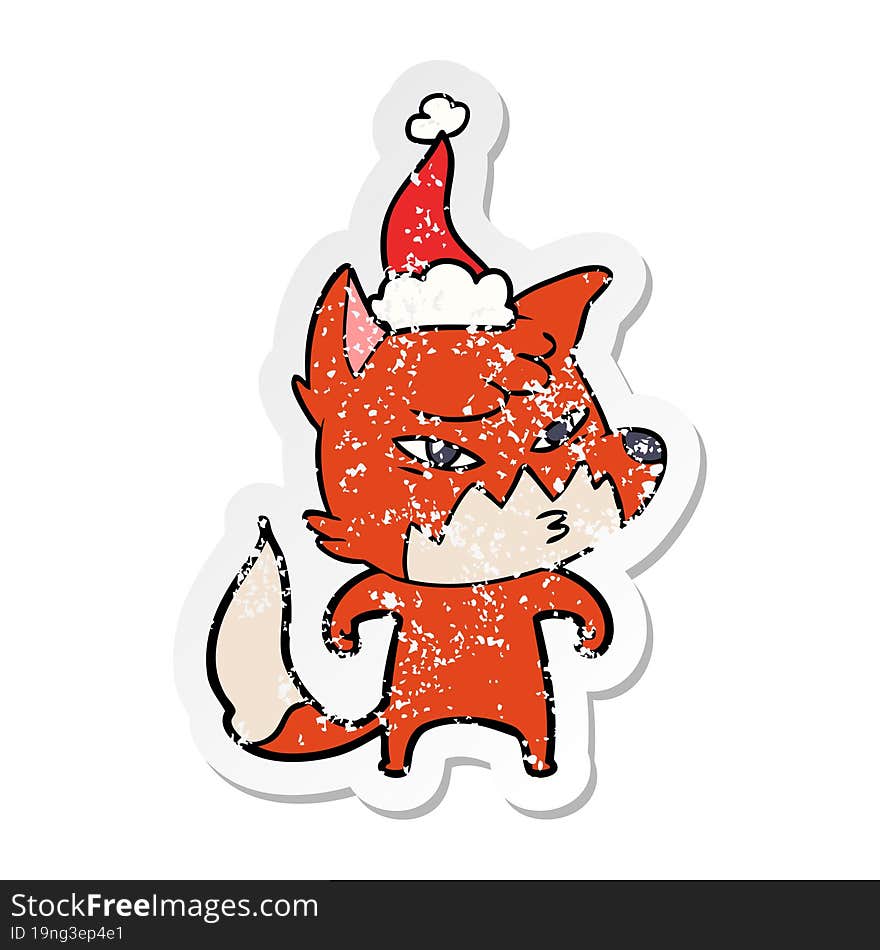 clever distressed sticker cartoon of a fox wearing santa hat