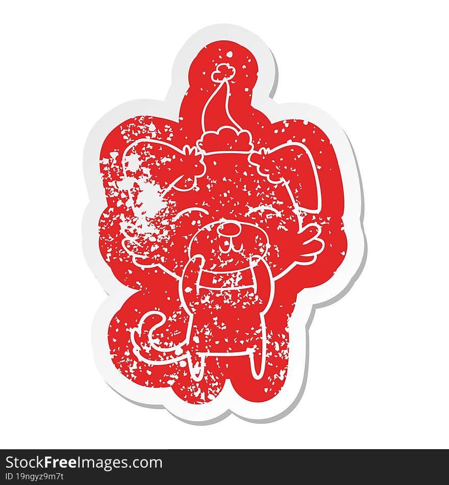 cartoon distressed sticker of a dog wearing santa hat