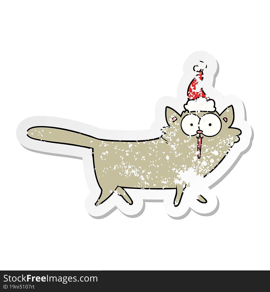 hand drawn distressed sticker cartoon of a cat wearing santa hat