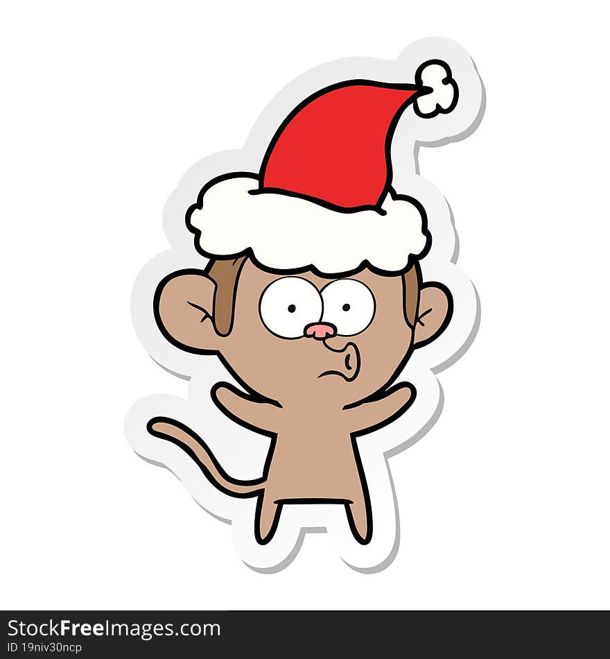 sticker cartoon of a surprised monkey wearing santa hat