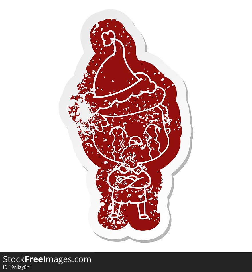 Cartoon Distressed Sticker Of A Man Crying Wearing Santa Hat