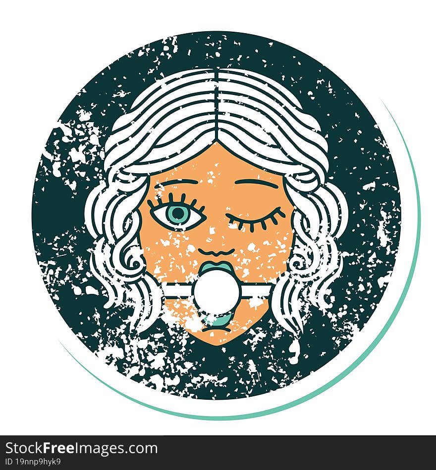 distressed sticker tattoo style icon of winking female face with ball gag