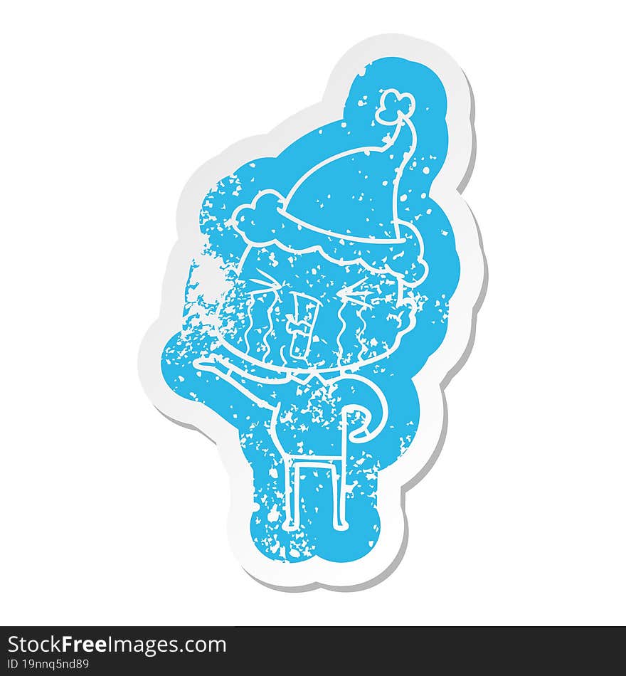 cartoon distressed sticker of a crying bald man wearing santa hat