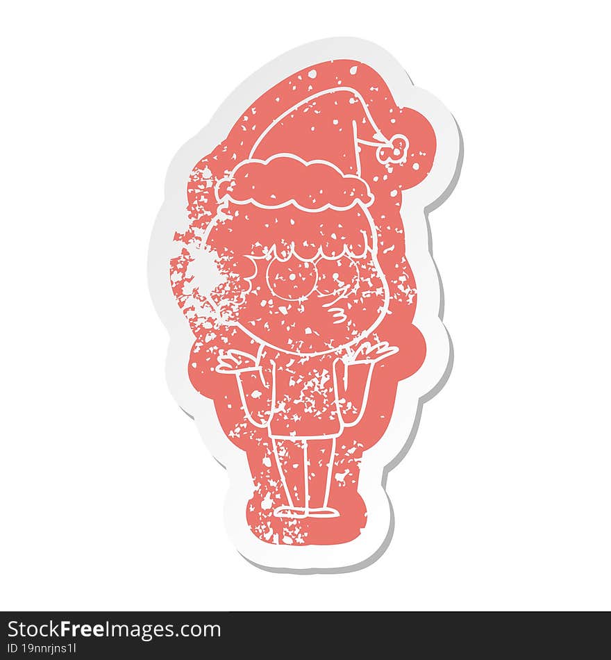 Cartoon Distressed Sticker Of A Curious Boy Shrugging Shoulders Wearing Santa Hat