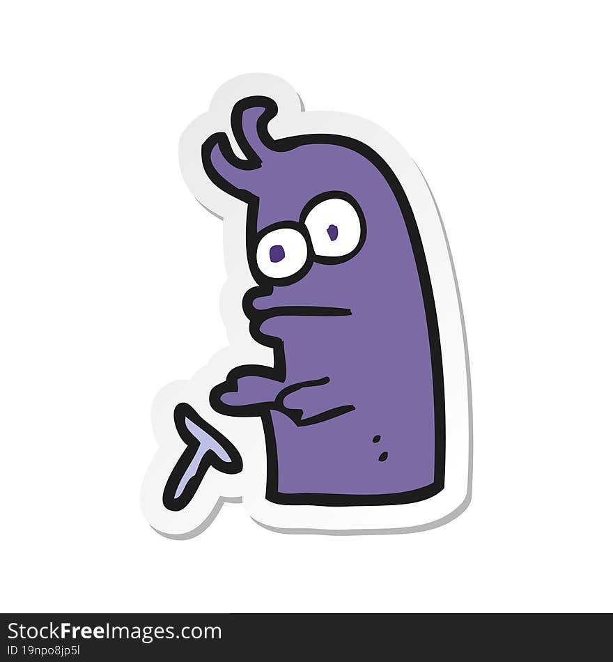 sticker of a cartoon little alien