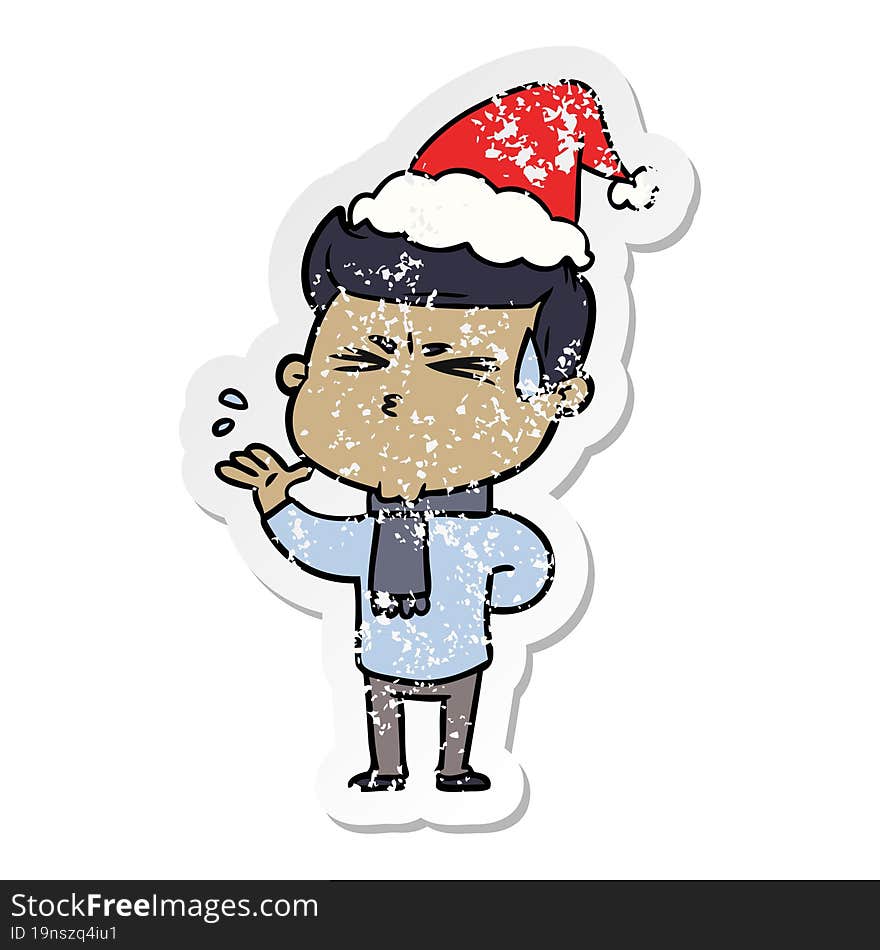 distressed sticker cartoon of a man sweating wearing santa hat